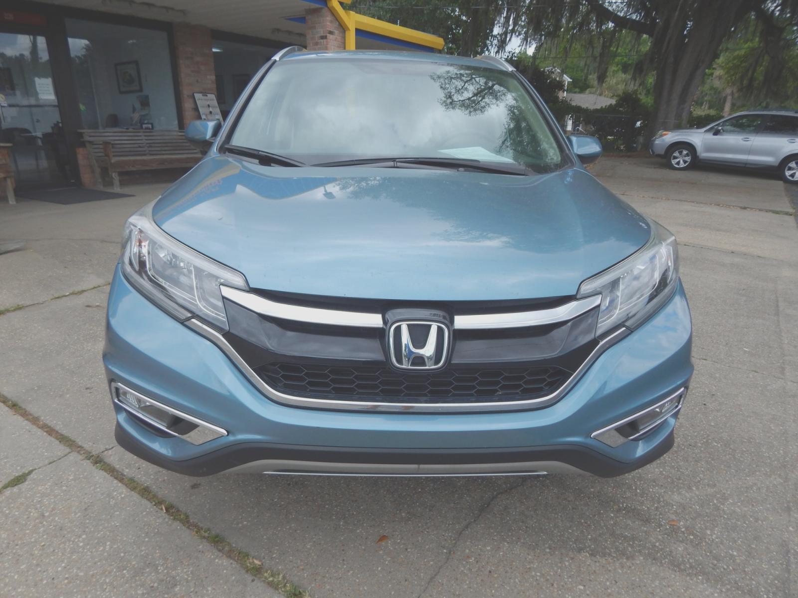 2015 Teal /Tan Honda CR-V (2HKRM3H53FH) with an 2.4L 4 cyl. engine, Automatic transmission, located at 3120 W Tennessee St, Tallahassee, FL, 32304-1002, (850) 575-6702, 30.458841, -84.349648 - Used Car Supermarket is proud to present you with this loaded immaculate 2015 Honda CRV EX with sunroof and low miles. Used Car Supermarket prides itself in offering you the finest pre-owned vehicle in Tallahassee. Used Car Supermarket has been locally family owned and operated for over 48 years. Ou - Photo #2